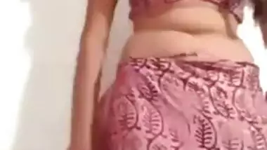 Pleasant Desi girl takes off pink dress in her first porn video