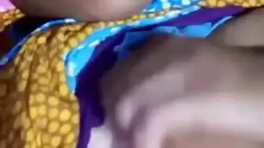 Pretty Desi MILF poses for the camera and teases with big XXX tits