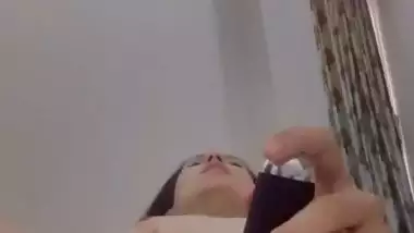 Nude Bhabhi presses boobs and fingers her pussy