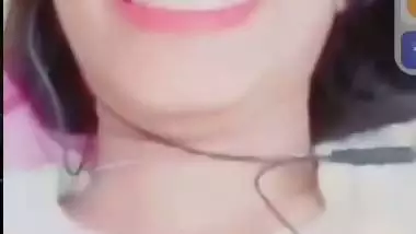 Smiling girlfriend video call to boyfriend shows boobs