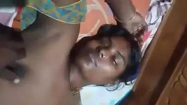 Village Desi XXX wife gets her boobs pressed by hubby while sleeping MMS